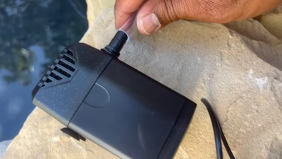 12. Connect the tubing to the pump and position the outlet for optimal water circulation.
