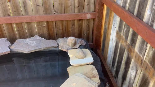 16. Place decorative rocks around the pond edges.