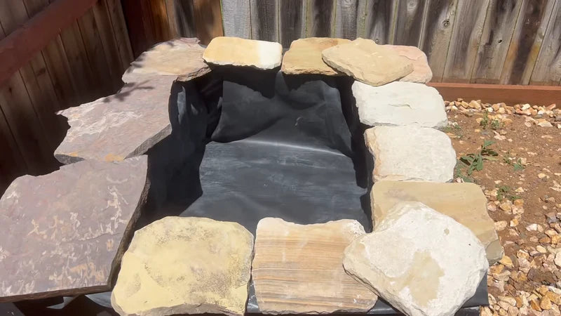 8. Use flat stones to secure the liner edges.